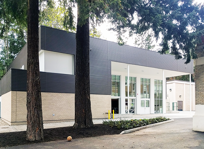 photo of a building with trees in front of it