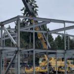 a steel building frame is being erected
