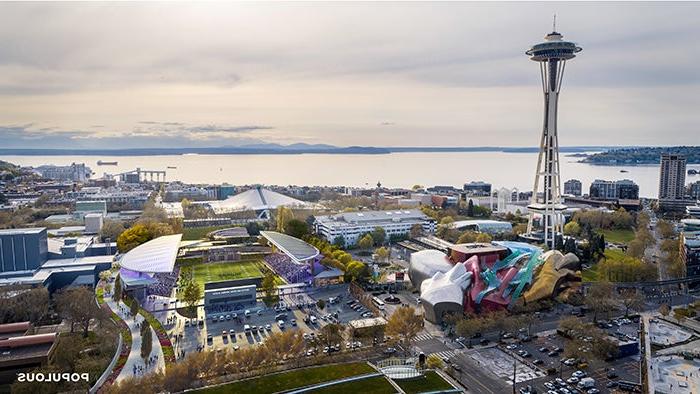 photograph of Seattle Center with multiple public buildings in the foreground and an expanse of water in the background - a double sided stadium has been digitally added with an athletic field